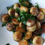 Quick crispy potatoes - ready in no time and lightly spiced with nigella seeds, cumin seeds and coriander seeds.