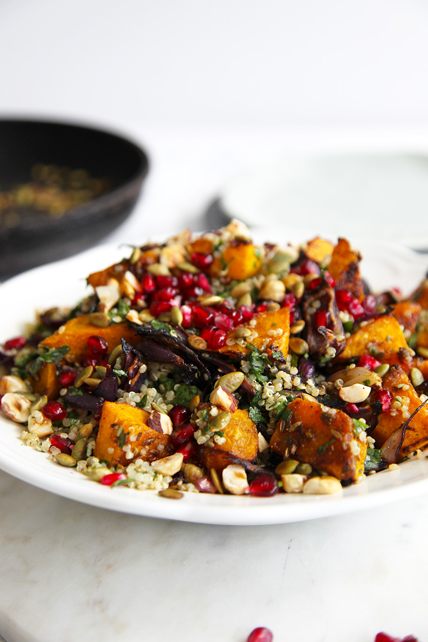 Roasted pumpkin quinoa salad - packed with herbs and garnished with pepitas, pomegranate & hazelnuts