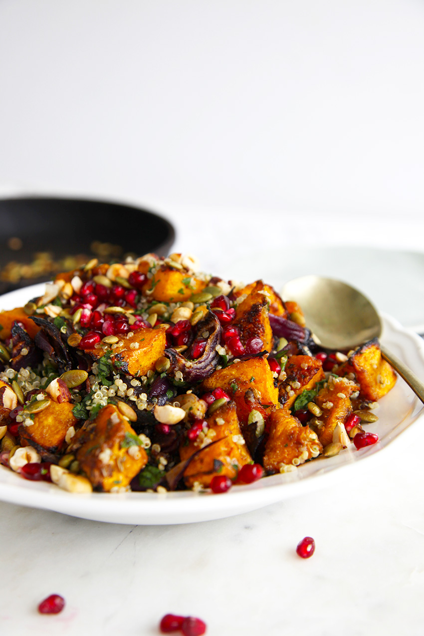 Roasted pumpkin quinoa salad - packed with herbs and garnished with pepitas, pomegranate & hazelnuts