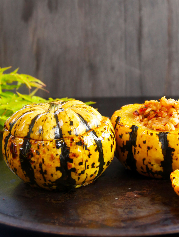 Baked minikin pumpkins stuffed with pearl barley for a healthy meat free meal