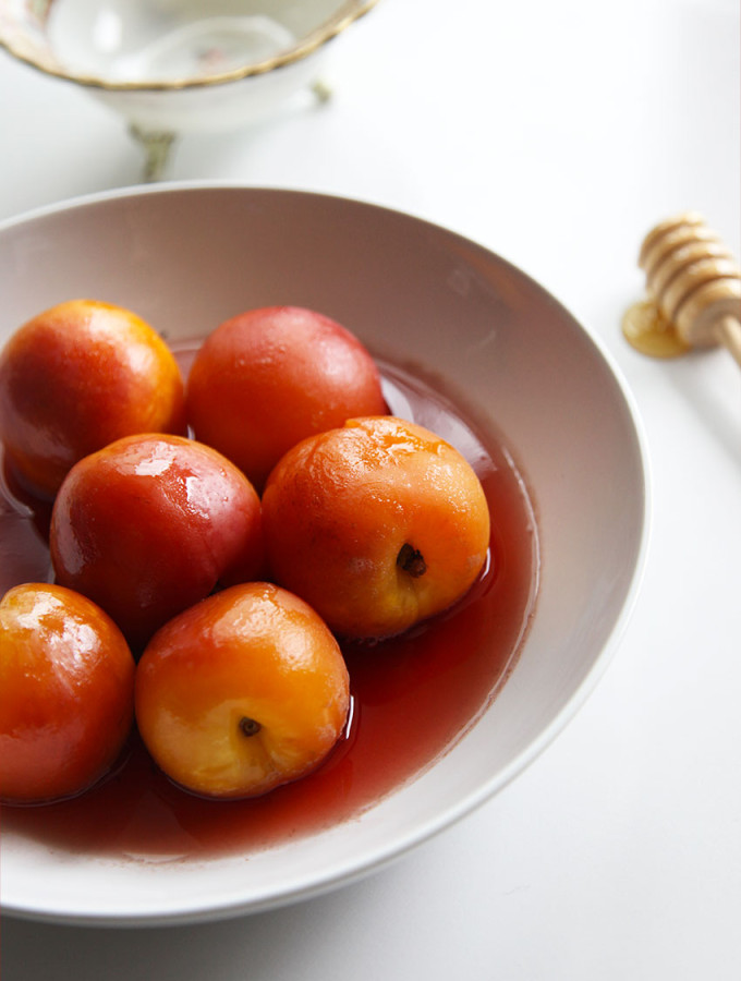 Poached nectarines in honey in black pepper
