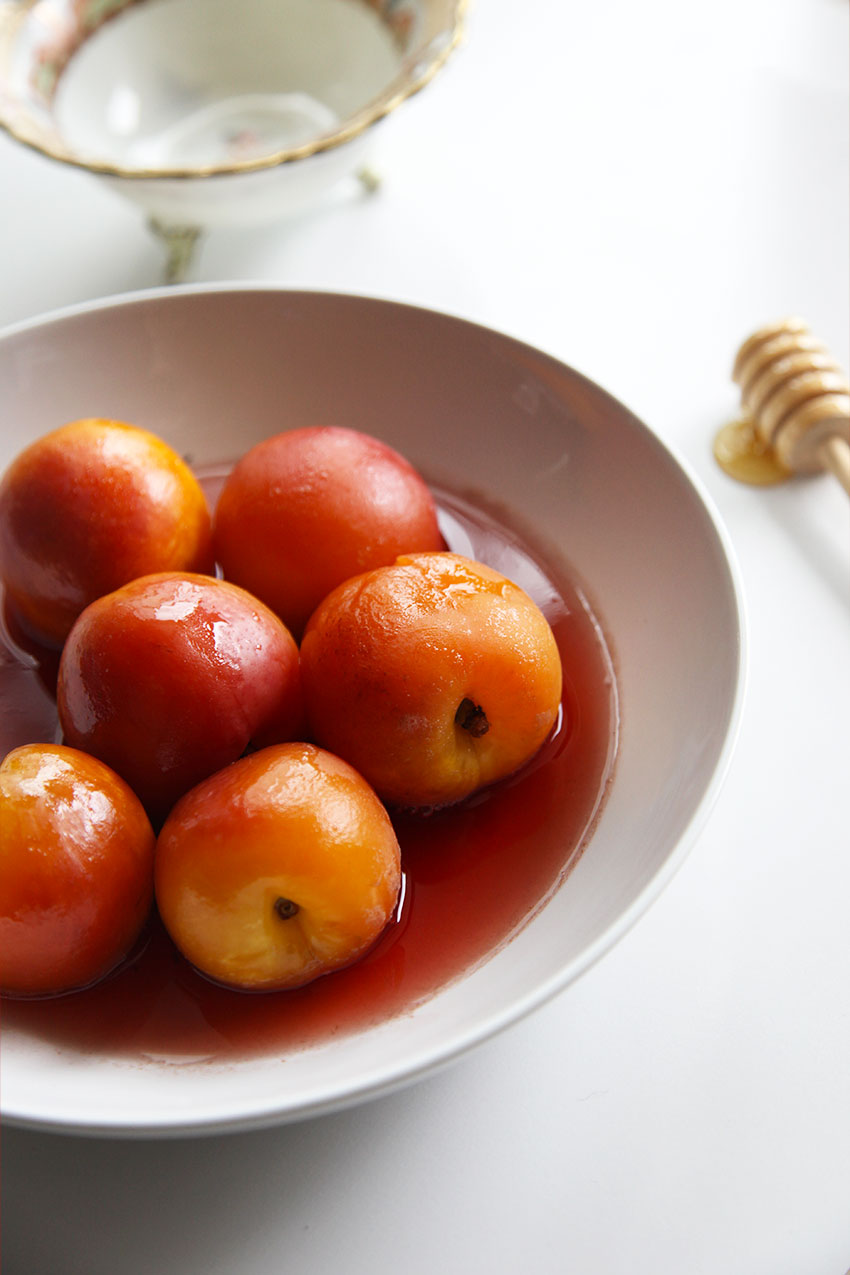 Poached nectarines in honey in black pepper