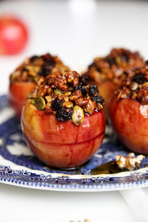 Healthy Baked Apples filled with fresh blackberries and topped with a crispy walnuts, pepitas, sultanas & maple